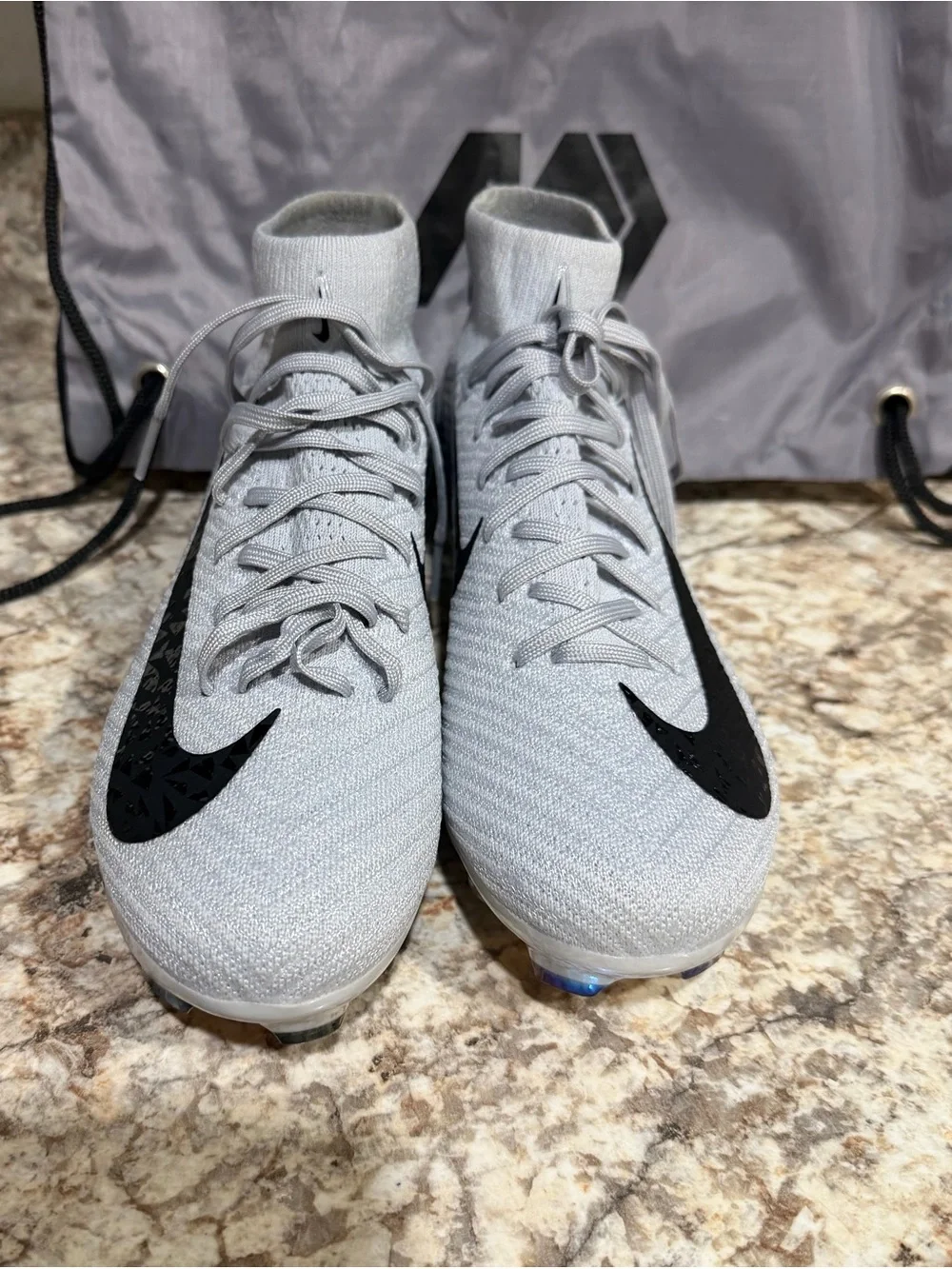 Nike Men’s Light Gray High-Top Soccer Cleats with Black Swoosh